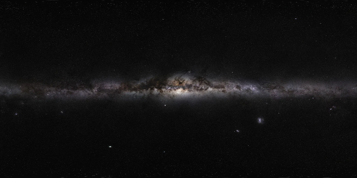 The Milky Way’s bright central bulge and dark dust lanes stretch across a full-sky photographic panorama.
